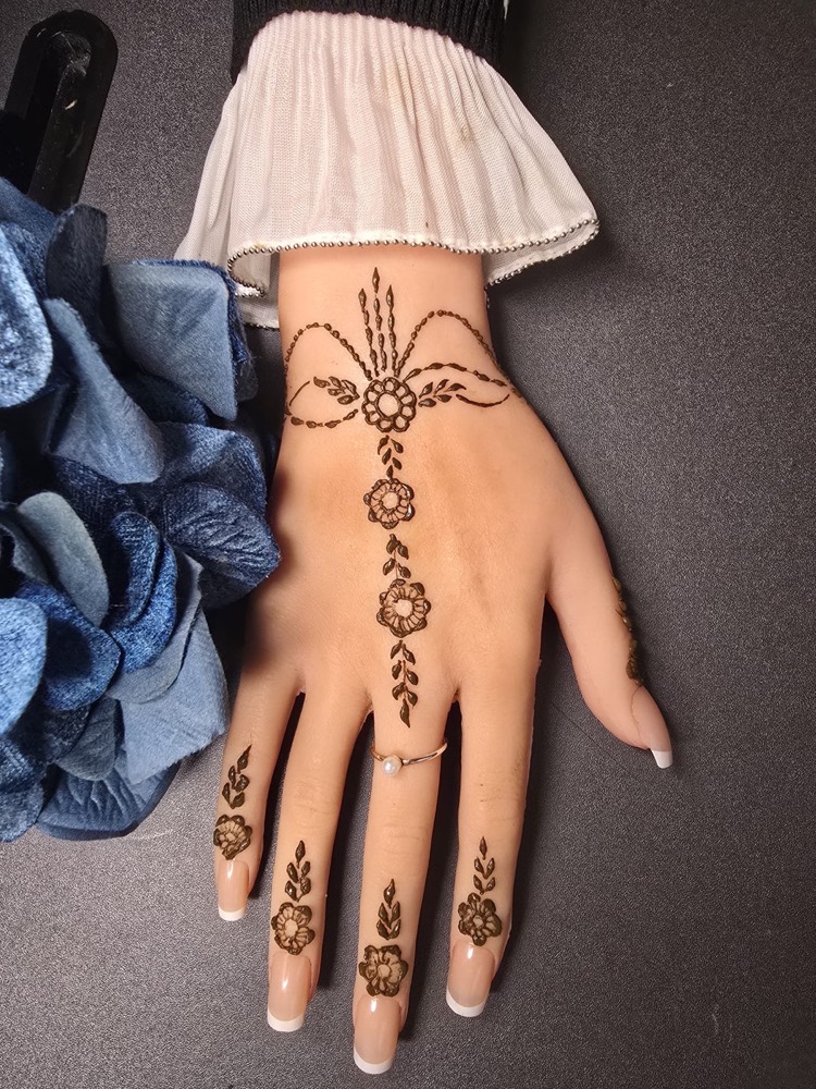 Jewellery style mehndi design with bracelet and ring inspired details