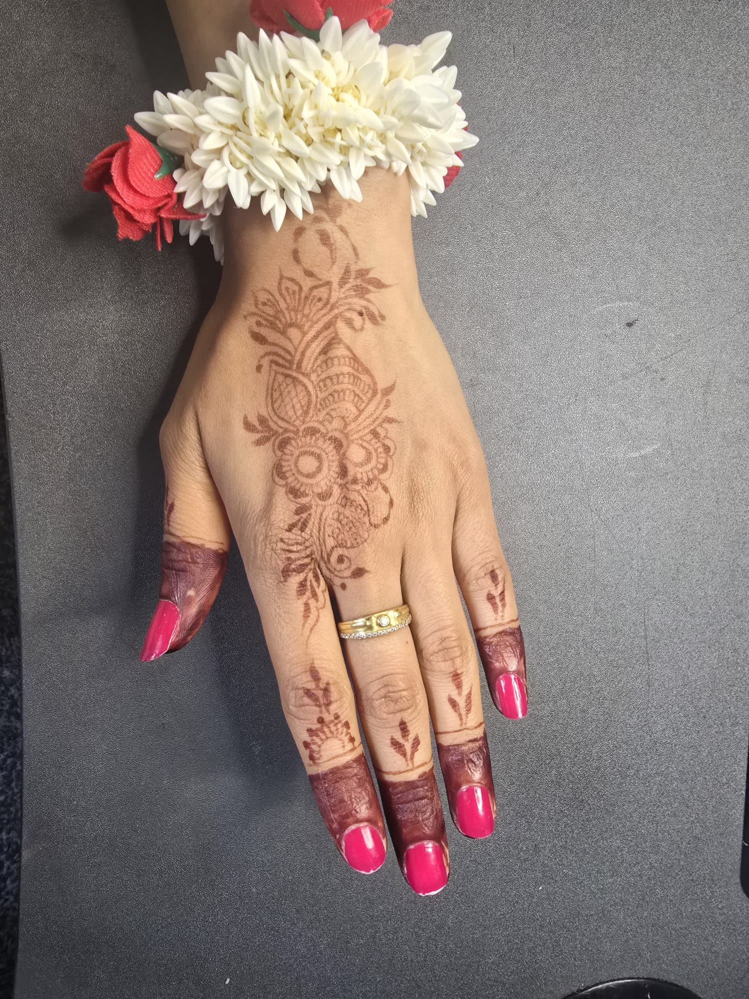 Stained floral mehndi look with fresh flowers for Shravan