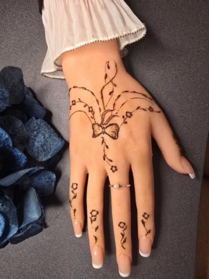 Soft mehndi style section with floral details