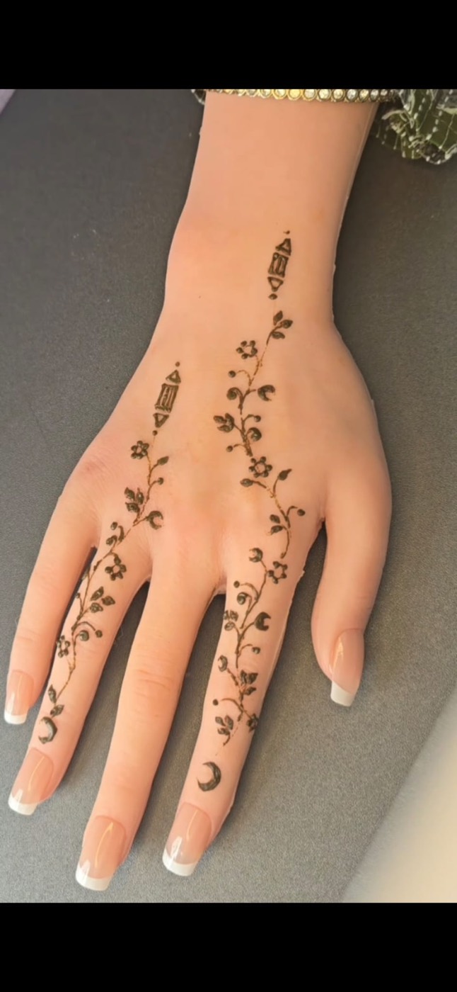 Eid hand henna design with lantern details